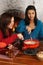 Women dipping bread into fondue