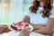 Women do not eat sweets and desserts. Hands sending a plate of strawberry bread, but the woman showed a declining intention to