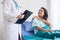 Women doctor reassuring her female asian patient in hospital room,Dentist giving a consultation and encouragement to patient