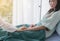 Women doctor reassuring her female asian patient in hospital room,Dentist giving a consultation and encouragement to patient toget