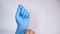 women doctor wears medical gloves, top view