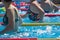 Women Doing Water Aerobics Outdoor in a Swimming Pool