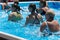 Women Doing Water Aerobics Outdoor in a Swimming Pool