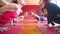 Women doing yoga class in hall