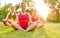 Women doing yoga outdoors at sunset