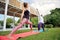 Women doing yoga by the poolside