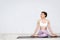 Women doing yoga in the white room at home