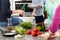 Women drinking beer and preparing food for party