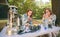 Women drinking cups of coffee in forest