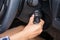 Women driver hand inserting car key
