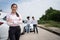 Women drivers stand in front of cars after accident and not worry because have car accident insurance. Online car accident