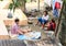 Women drying candlenuts