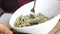 women eating homemade cooked pasta in a plate on table .