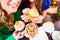 Women eating muffins while coffee drinking