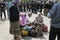 Women eating on pavement, police watching on a background. May 25, 2013. Kiev, Ukraine