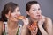 Women eating pizzas