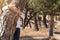 women embracing trees while meditating on the forest.