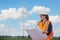 Women engineer working on site at wind turbine farm