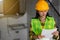 Women engineering with hard hat at construction site