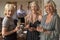 Women Enjoying Champagne At A Dinner Party