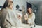 Women enjoying in hotel room.Young happy smiling woman wearing bathrobe using hair dryer in bathroom