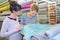 Women examining roll material