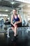 Women exercise already painful. Caucasian female having pain in her leg while workout at the gym. Woman feeling strong pain in