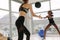 Women exercising with medicine ball in gym