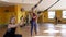 Women exercising with suspension trainer at gym