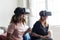 Women experiencing virtual reality with VR headset