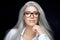 Women eyewear. Stylish silver hair woman in clear glasses staring at camera with confidence in herself. Beauty portrait isolated