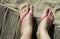 Women foots on the beach