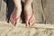 Women foots on the beach