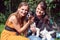 Women friends playing with dogs in the animal shelter