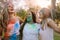 Women friends playing holi in a park