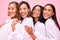 Women, friends smile and portrait in studio with natural beauty, diversity and white shirt with laugh. Pink background