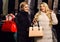 Women in fur coats with bags in fur shop.