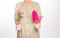 Women gardener tools pink colored bouquet flowers