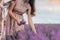 Women gather lavender flowers