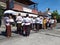 Women Gather On The Street Waiting For The Accompaniment Of Other People In The Hot Sun In A Cremation Ceremony Ngaben In Bali