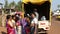 Women gathered around a truck buying chai from local seller.