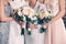 Women generation family and bride holding flowers bunches on wedding day