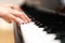 Women hand on classic Piano keyboard closeup, music instruments concept