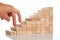 Women hand finger walk on stacked wooden block