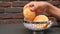 women hand pick a baked bread on table