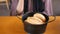 women hand pick baked bun on table