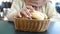 women hand pick bread bun on table