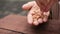 women hand pick cashew nuts closeup