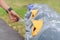 Women hand put used bottle in recycle bin