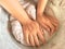 Women hand thresh flour in enameled bowl.